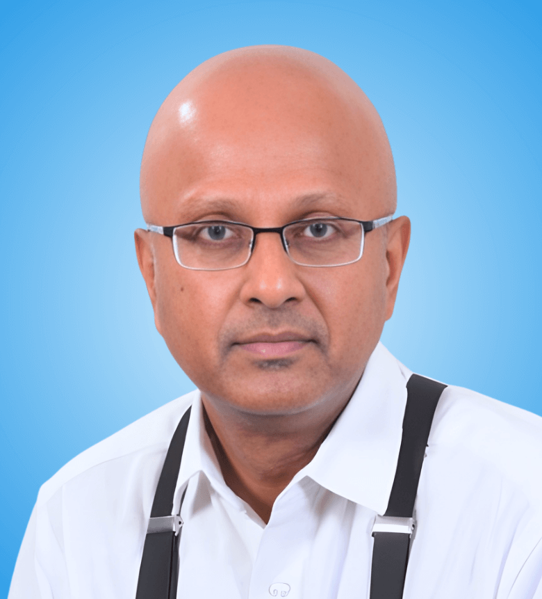 Portrait of Dr. Manohar Babu, Chief Medical Officer (CMO) at Aravind Eye Hospital, Salem, and Past President (2016-2018) of the Uveitis Society of India (USI), specialist in ocular inflammatory diseases.